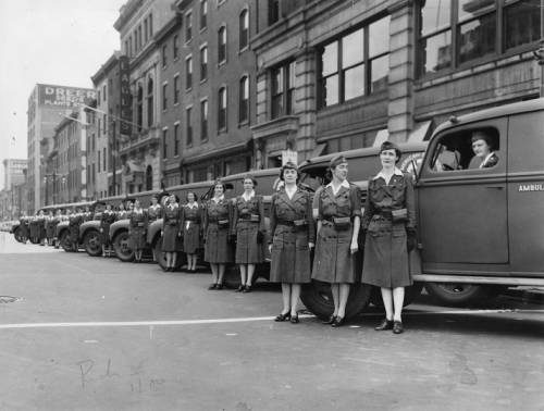 American Red Cross Motor Corps volunteers lined up with ambulances at Broad and Spring Garden near the Dreer Seeds building, November 1942