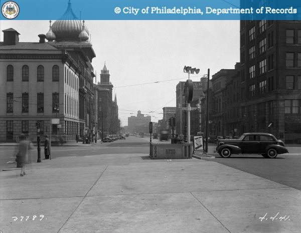 Broad and Spring Garden intersection in 1941 showing a subway entrance, traffic signals, and LuLu Temple dome