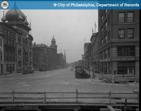 Spring Garden Street looking east from Broad in 1926 with subway construction planking, trolley tracks, and LuLu Temple
